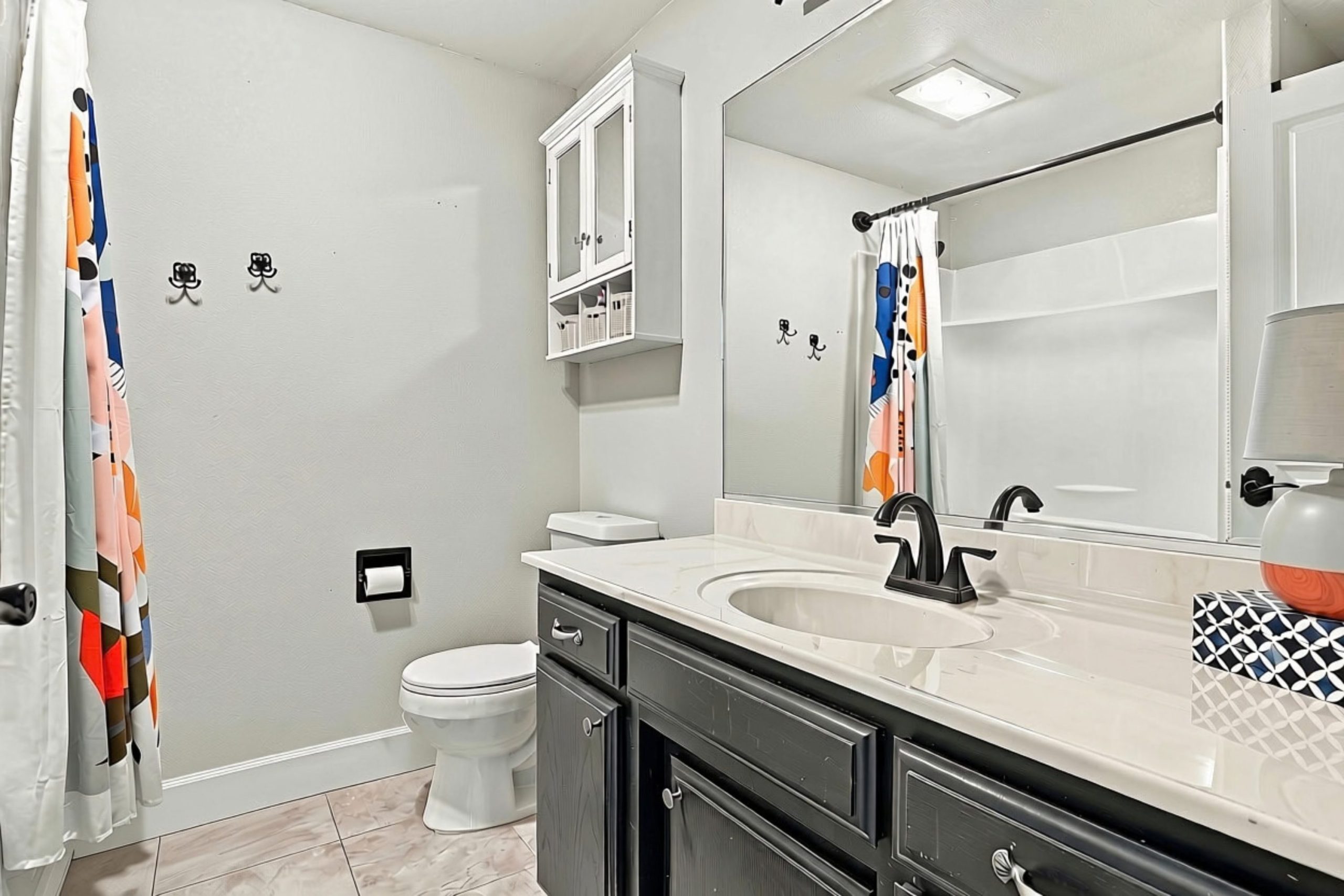 Bathroom with dark vanity at 947 Brandon Street