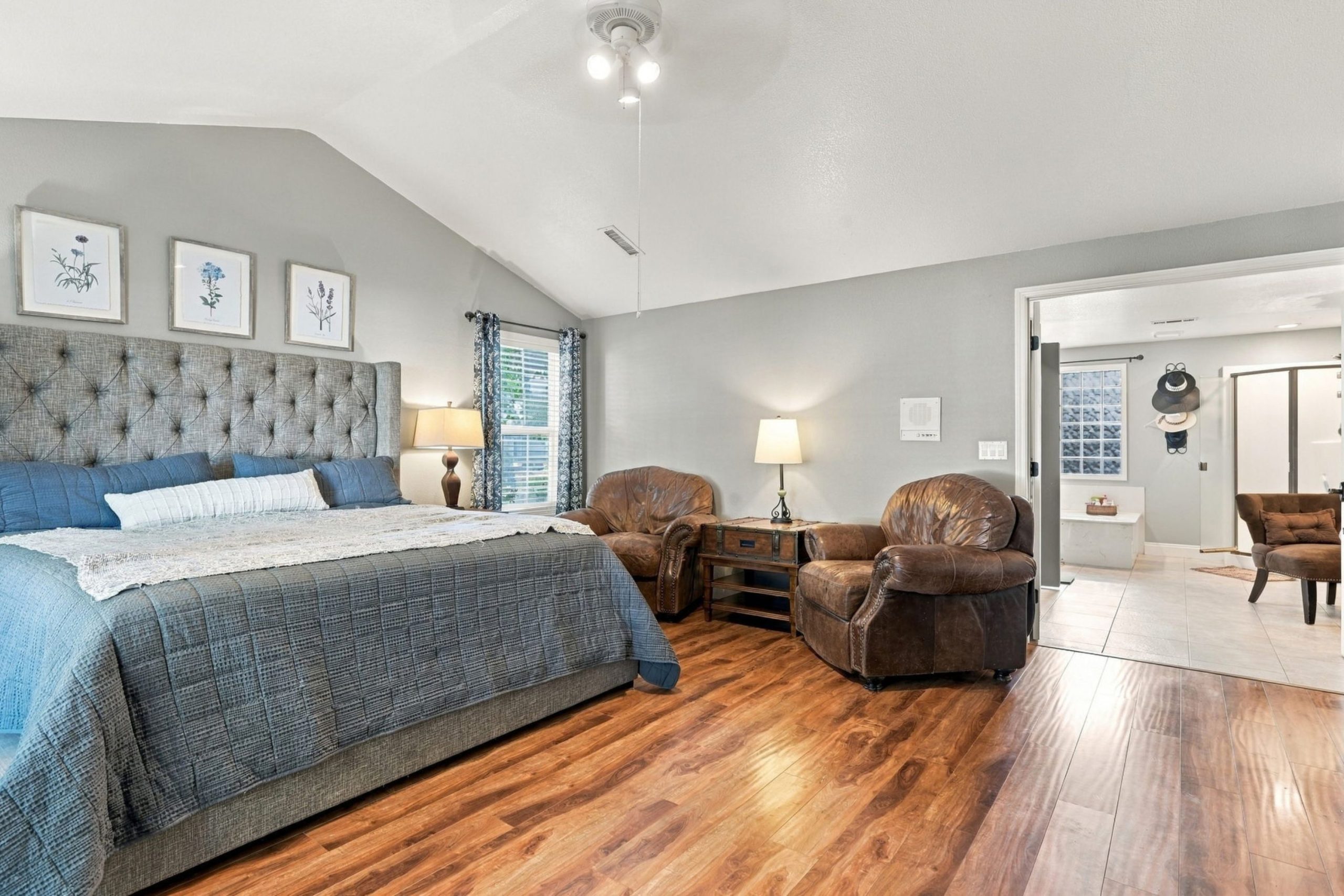Primary bedroom with vaulted ceiling and sitting area at 947 Brandon Street