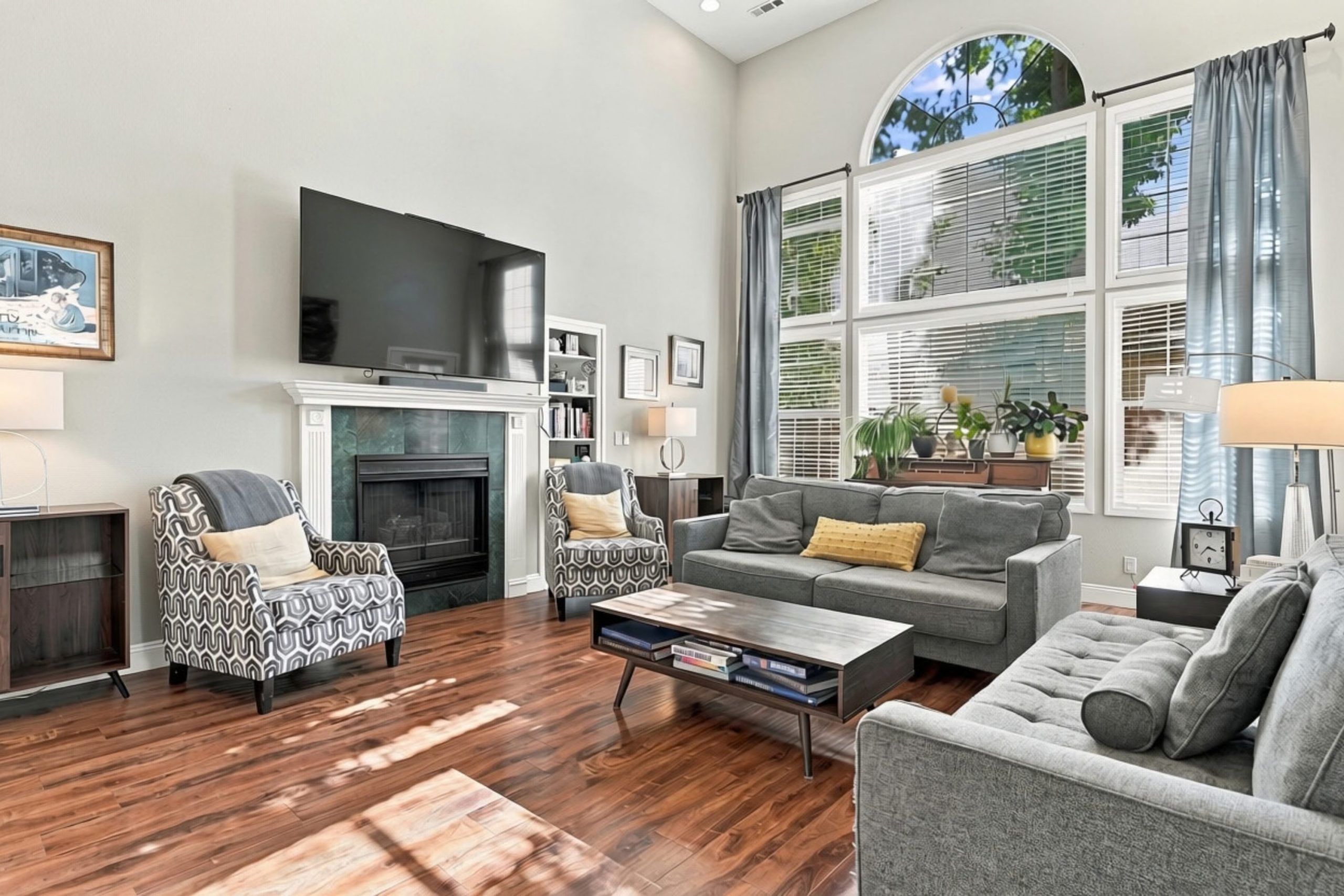 Vaulted great room with arched windows and gas fireplace at 947 Brandon Street