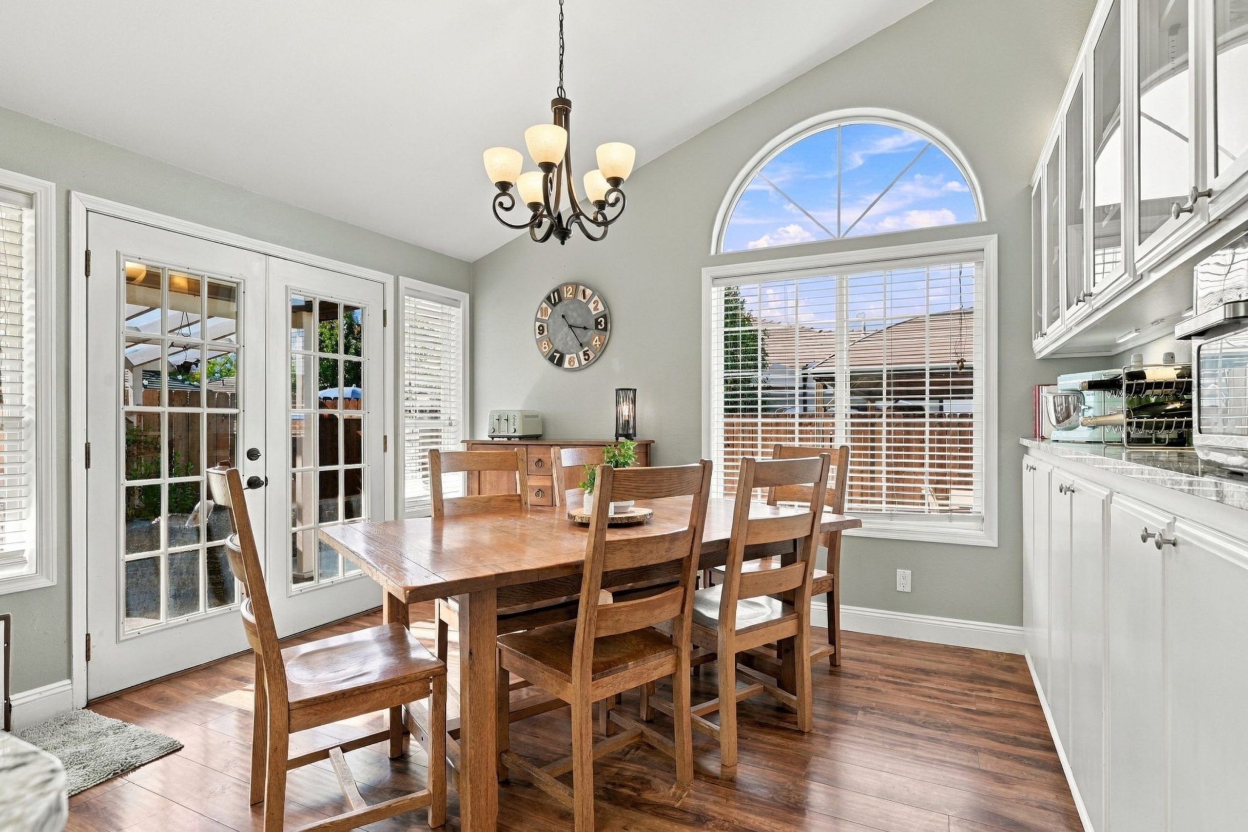 Dining area with chandelier and French doors at 947 Brandon Street